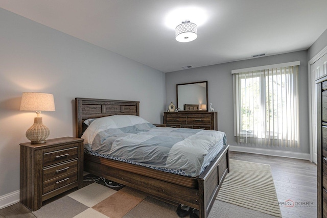 bedroom with hardwood / wood-style floors