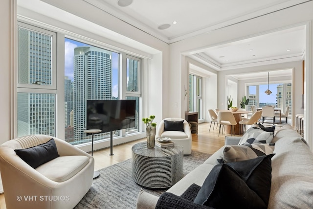 living room featuring ornamental molding and hardwood / wood-style floors