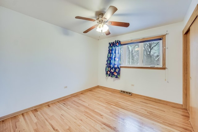 unfurnished room with light hardwood / wood-style flooring and ceiling fan