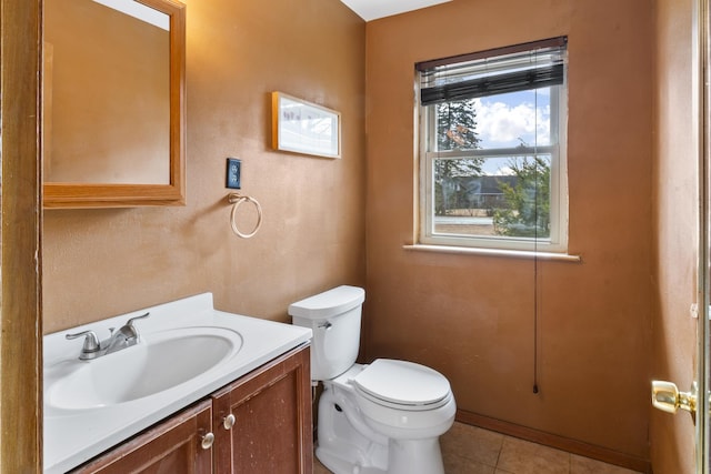 bathroom with tile patterned floors, vanity, and toilet