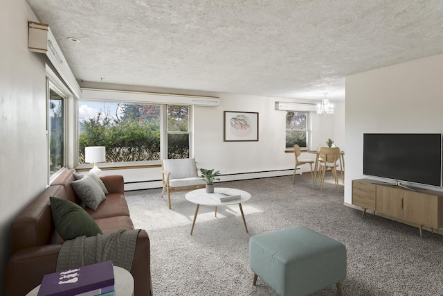 living room featuring a chandelier, a textured ceiling, and baseboard heating