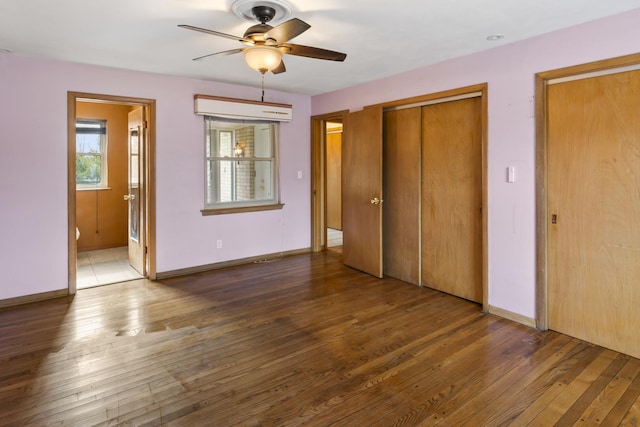 unfurnished bedroom featuring ceiling fan, dark hardwood / wood-style flooring, and ensuite bath