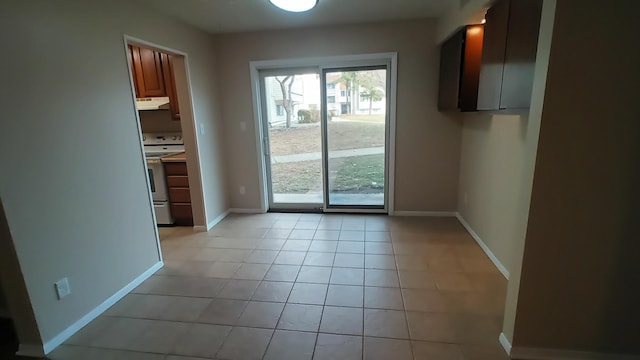 doorway to outside featuring light tile patterned floors