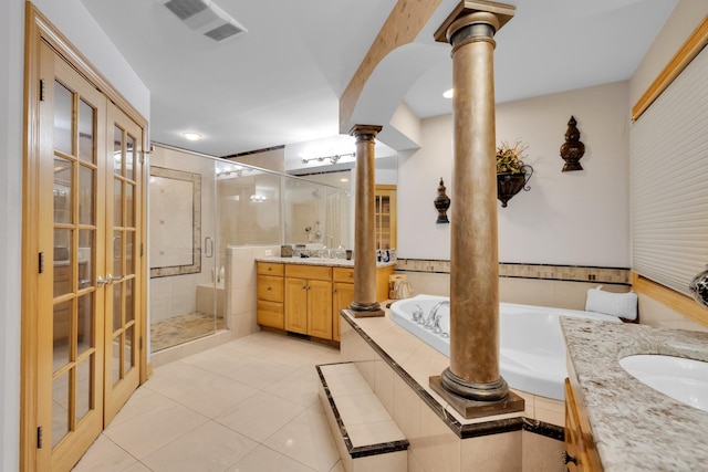 bathroom featuring ornate columns, vanity, separate shower and tub, and tile patterned flooring