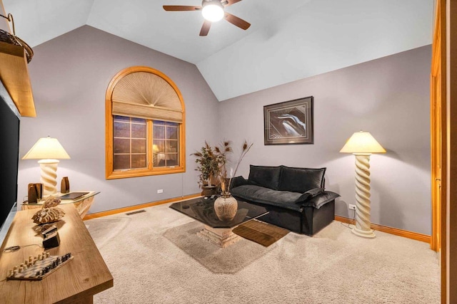 carpeted living room with lofted ceiling and ceiling fan