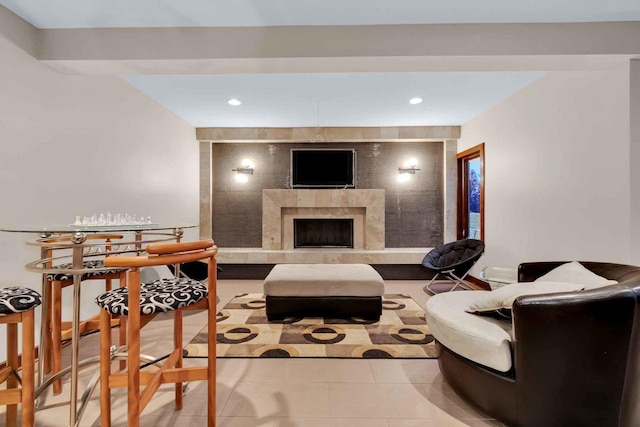 tiled living room with a tile fireplace