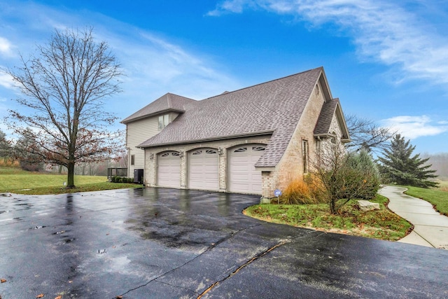 view of side of home with a garage