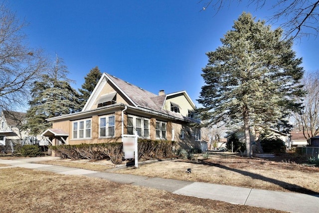 view of home's exterior featuring a chimney