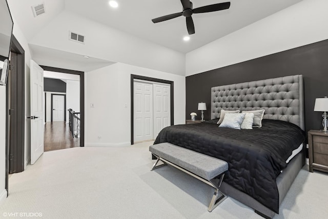 carpeted bedroom featuring ceiling fan, high vaulted ceiling, and a closet