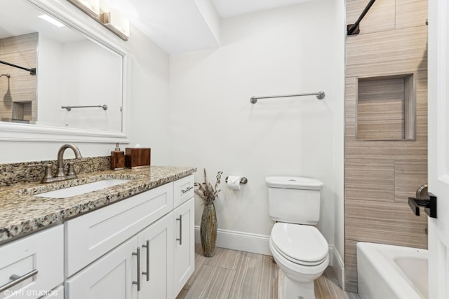 full bathroom featuring vanity, bathing tub / shower combination, and toilet