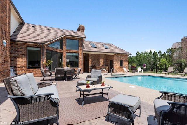 view of swimming pool with a patio area