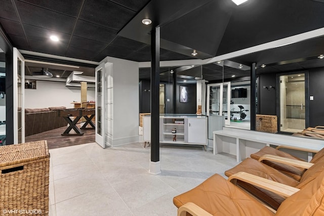 basement with light tile patterned flooring