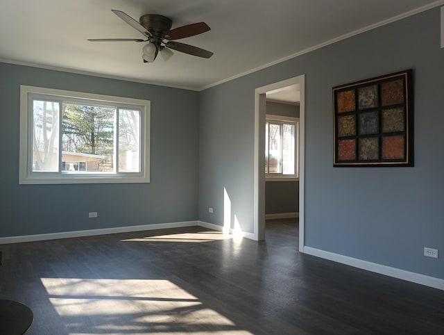 empty room with plenty of natural light, baseboards, and ornamental molding