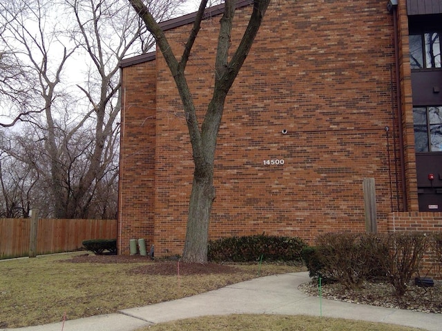 view of home's exterior featuring a yard