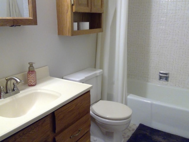 full bathroom with vanity, shower / tub combo with curtain, and toilet