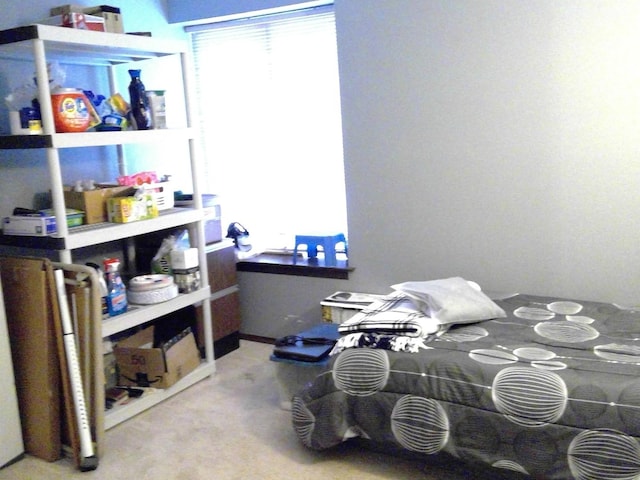 bedroom featuring concrete flooring