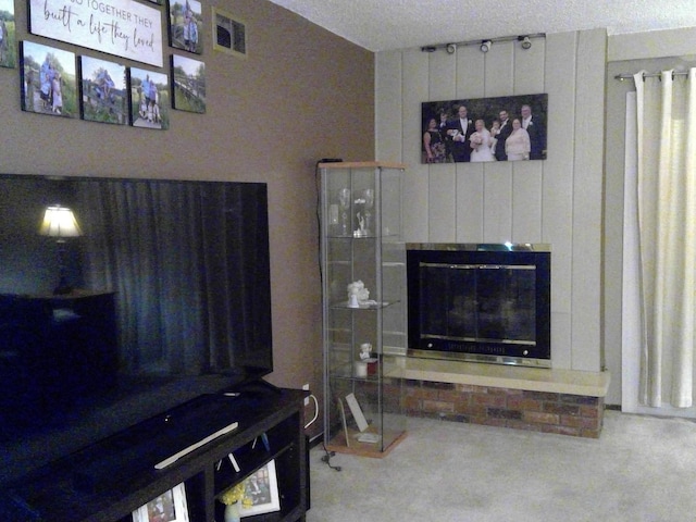 living room with a brick fireplace