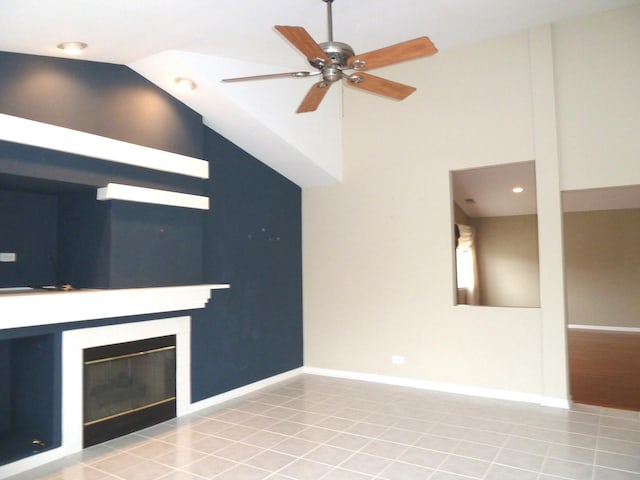 unfurnished living room featuring ceiling fan, high vaulted ceiling, and light tile patterned floors