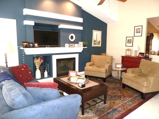 living room featuring high vaulted ceiling and ceiling fan