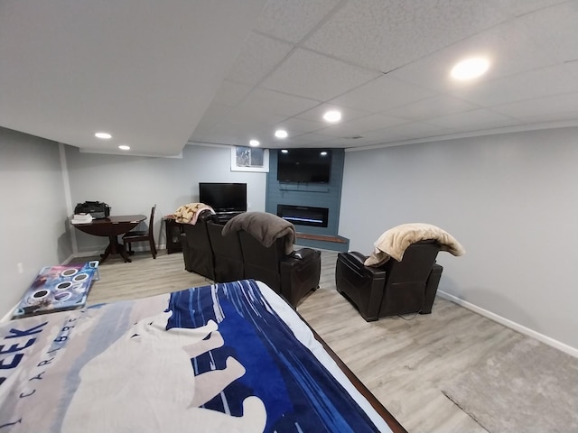 bedroom featuring a fireplace and hardwood / wood-style floors