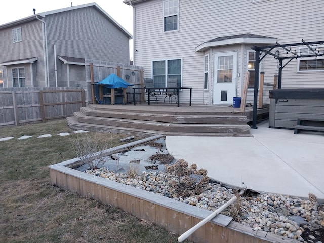 back of house featuring a pergola and a deck