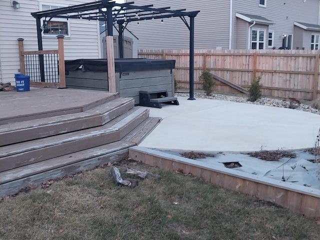 snow covered deck featuring a hot tub and a pergola