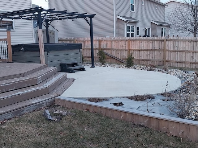 exterior space with a hot tub and a pergola