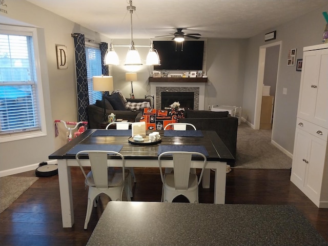 dining room featuring dark wood-type flooring and ceiling fan