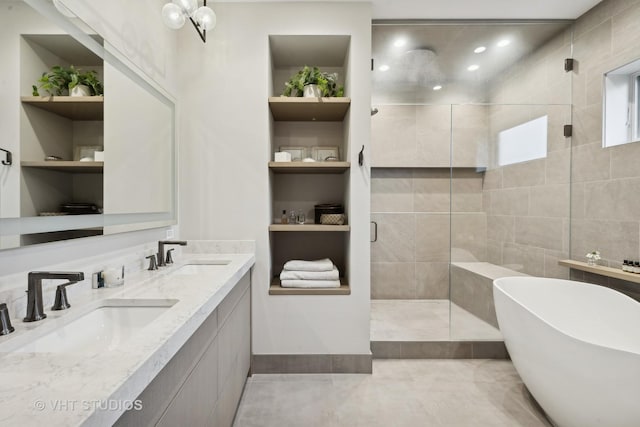 bathroom with plus walk in shower, tile walls, vanity, and built in shelves