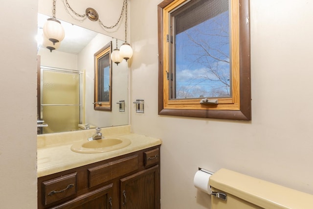 bathroom with an enclosed shower and vanity