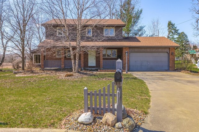 traditional-style house with an attached garage, a porch, brick siding, and concrete driveway