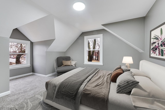 carpeted bedroom featuring lofted ceiling