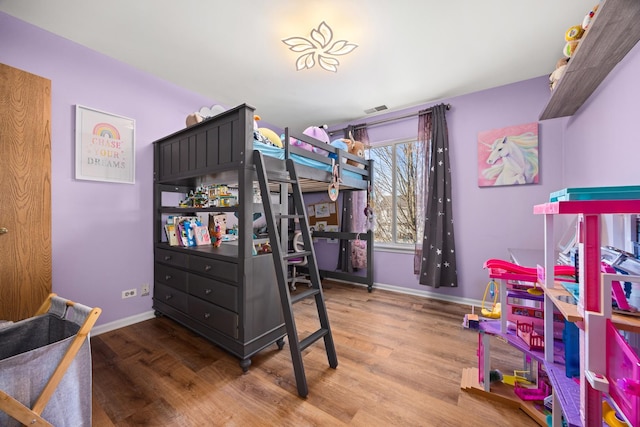 bedroom with wood-type flooring