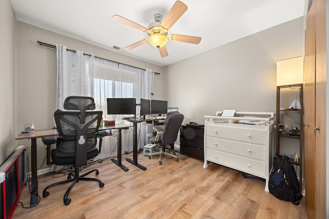 office with ceiling fan and light wood-type flooring