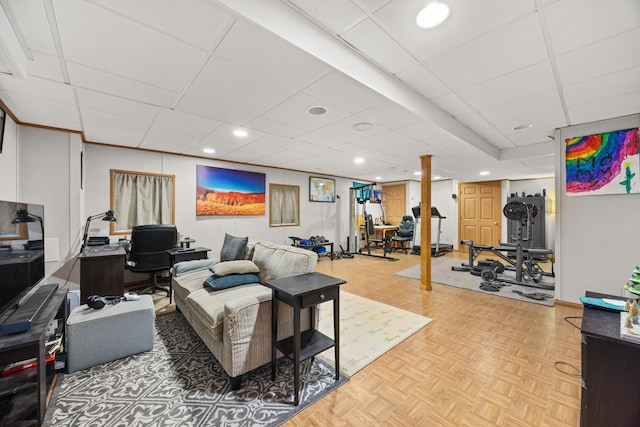 living room featuring light parquet flooring and a paneled ceiling