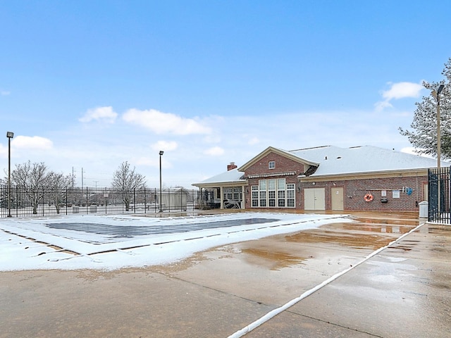 view of snow covered pool