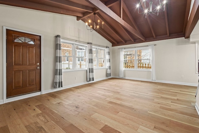 entrance foyer featuring an inviting chandelier, beam ceiling, high vaulted ceiling, and light hardwood / wood-style flooring