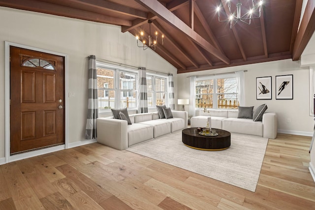 living area with high vaulted ceiling, a notable chandelier, baseboards, light wood-type flooring, and beamed ceiling