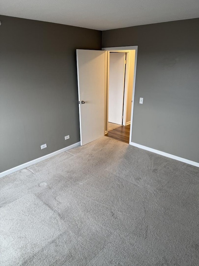 unfurnished room with carpet floors