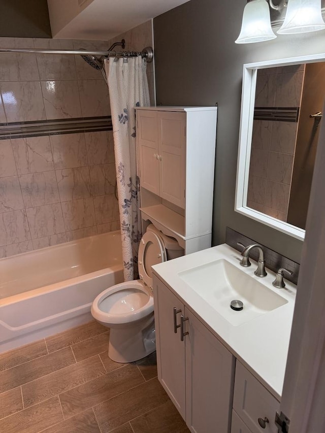 full bathroom featuring vanity, shower / bathtub combination with curtain, and toilet