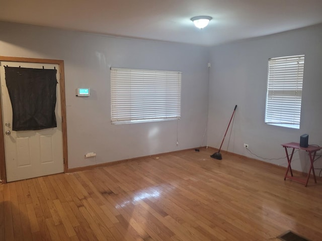 unfurnished room featuring light hardwood / wood-style floors