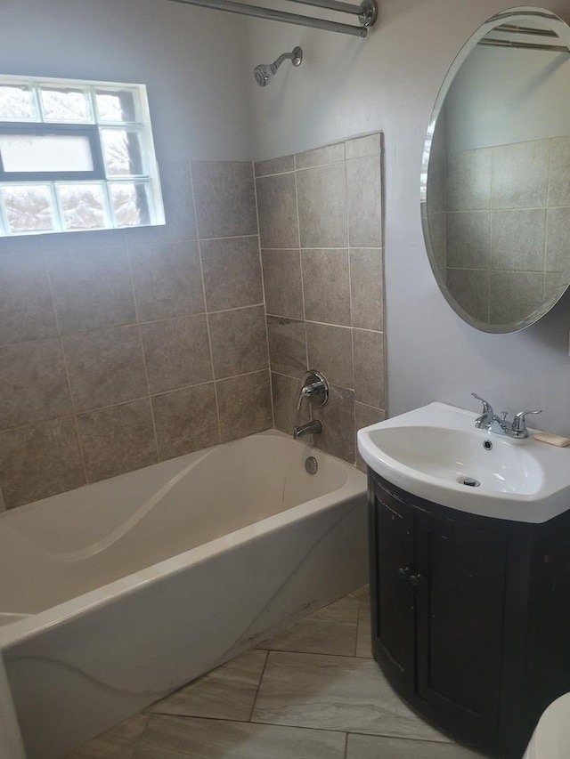 bathroom with vanity and washtub / shower combination