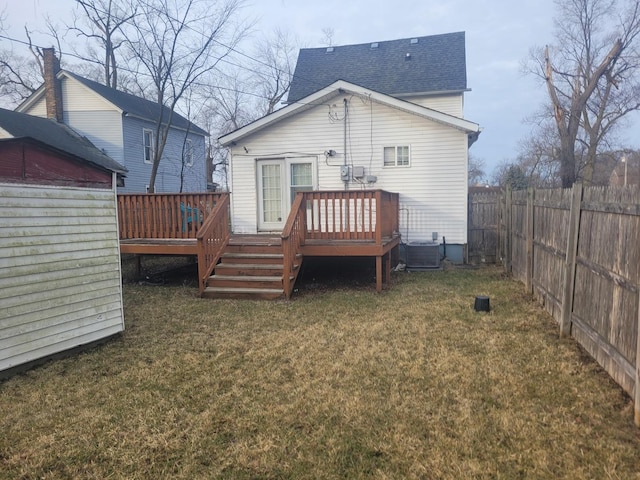 back of house with a wooden deck, a yard, and central air condition unit