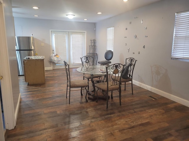 dining space featuring dark hardwood / wood-style floors