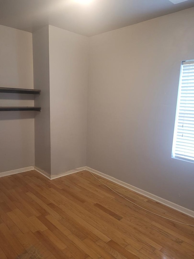 unfurnished room featuring light hardwood / wood-style floors