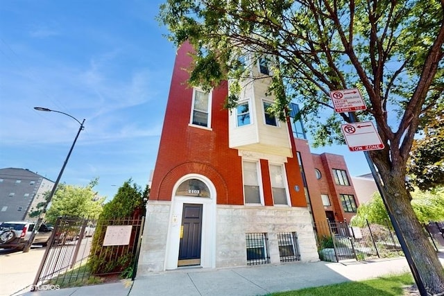 view of building exterior featuring fence