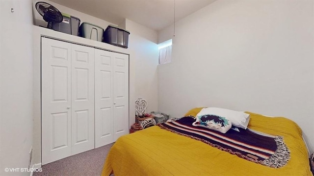 carpeted bedroom with a closet