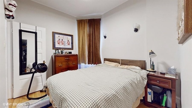 bedroom with wood finished floors