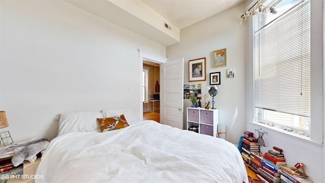 bedroom featuring visible vents