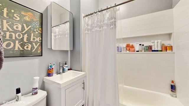 full bath featuring shower / tub combo, vanity, and toilet